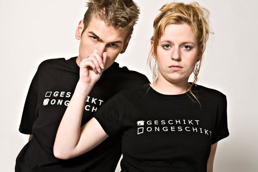 Couple of teenagers in the studio on a white background
