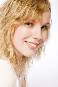 Studio portrait of a curly blond female