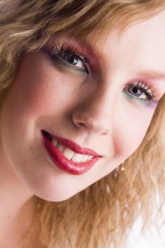 Studio portrait of a curly blond female