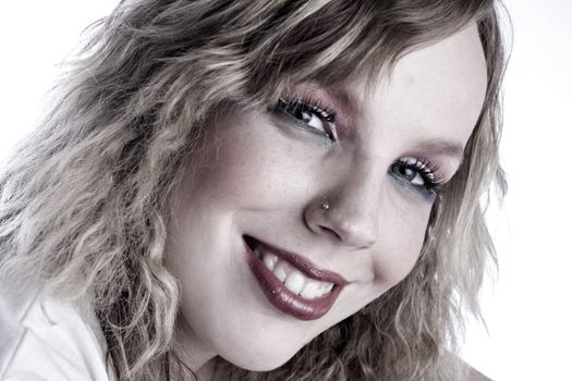 Studio portrait of a curly blond female