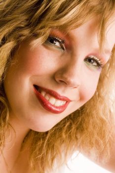 Studio portrait of a curly blond female