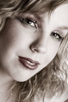 Studio portrait of a curly blond female