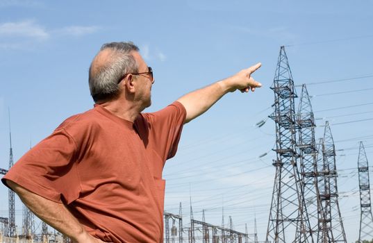 The man on a background of electric substation