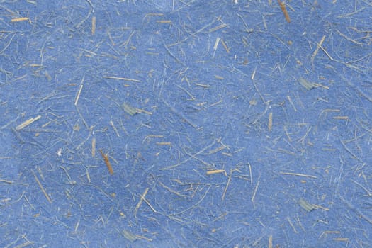Blue paper texture with grass fibers.