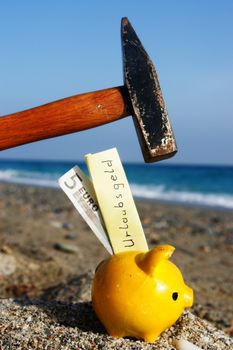 closev up of yellow piggybank with hammer