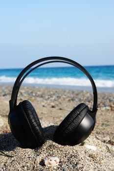 blue and black headphones over a white background