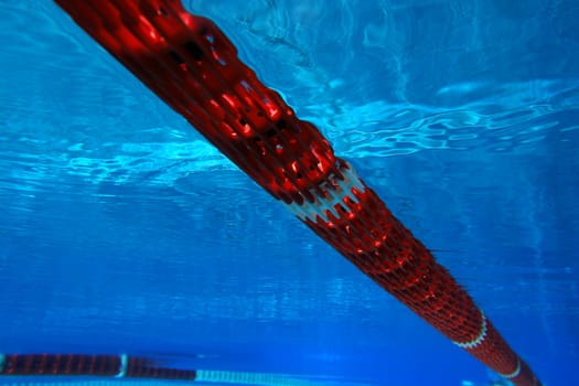 underwater view from a swimming pool with red marking