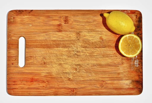 two lemons on the kitchen board, concept, space for text