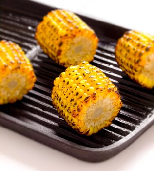 close up of grilled corn cobs