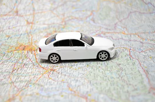 concept small white toy car on italy map