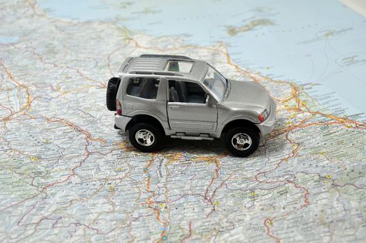 concept small grey jeep car on italy map