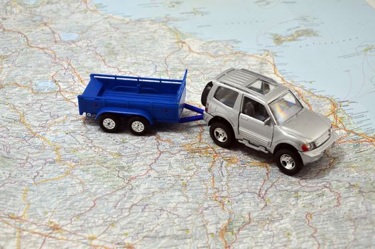 concept small jeep with trailer toy car on italy map
