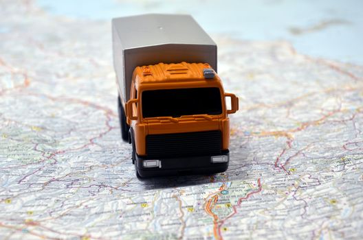 concept small white toy car on italy map