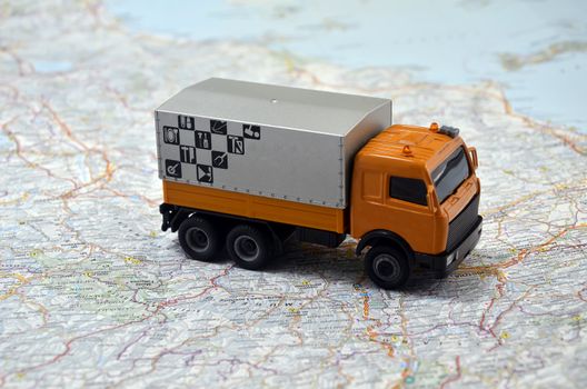 concept small white toy car on italy map