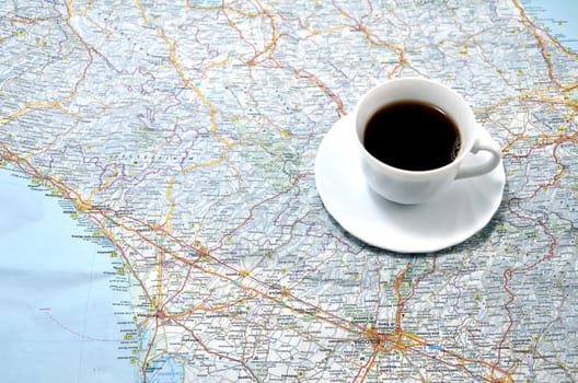 cup of coffee on the map. concept