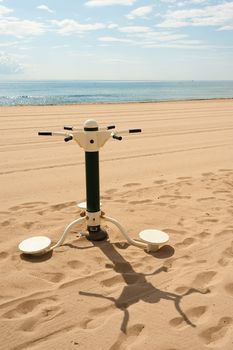 Fitmess machine outdoors on a sunny Mediterranean beach