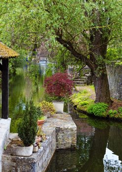 Colorful garden on a river in Chartres France.