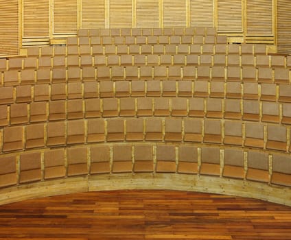 Geometric image of a wooden lecture room.