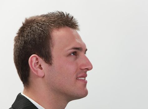 Profile of a young successful businessman.