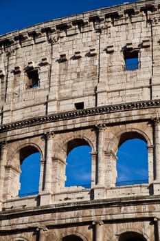 Colosseum in Rome with blue sky, landmark of the city