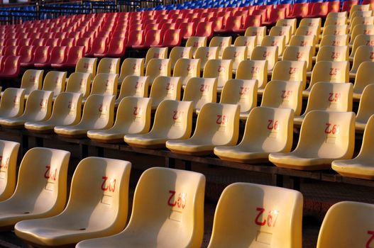 Row of plastic chairs in an open theater