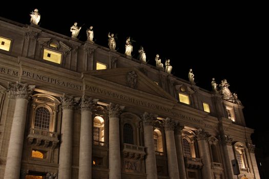 The front of St. Peter's Basilica, in Vatican city at night.
