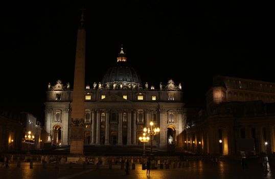 The front of St. Peter's Basilica, in Vatican city at night.
