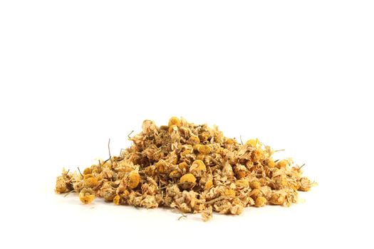 dried yellow chamomile flowers on a white background