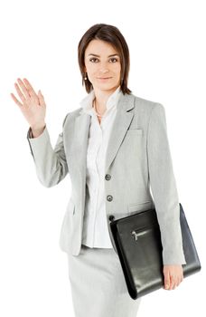 Smiling businesswoman on white background, holding briefcase waving