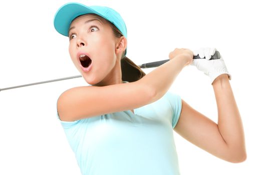 Woman playing golf surprised over golf swing. Female golf player with swinging golf club isolated on white background. Asian Caucasian woman.