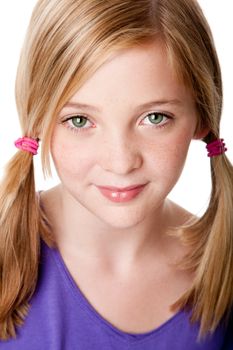 Beautiful cute sincere face of happy teenager girl with pigtails, blond hair, green eyes and freckles, isolated.