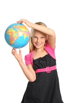Cute and confident young preteen girl holding the world globe in her fingers