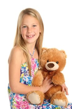 Lovely smiling blond girl kid with her stuffed toy animal