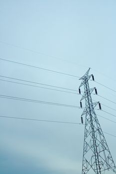 Electrical tower against blue sky