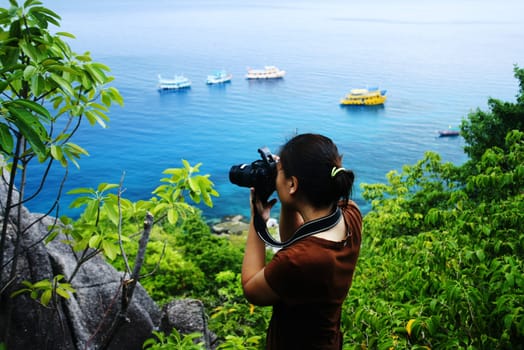 Woman taking photo of a nature