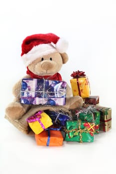 a teddy bear with colorful Christmas presents