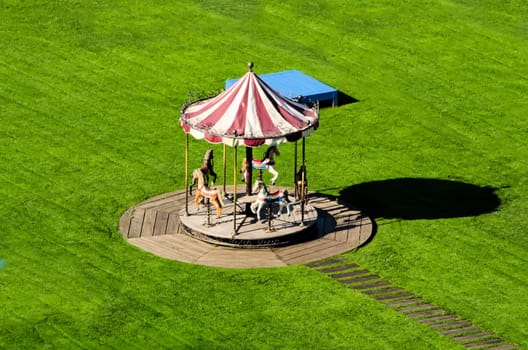 the carousel in the green meadow