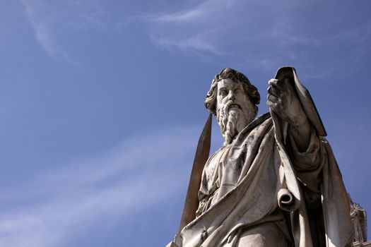 A statue of St. Paul backed by blue sky, Vatican City, Rome.
