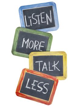 listen more, talk less - communication concept or advice - white chalk handwriting on small slate blackboards, isolated on white