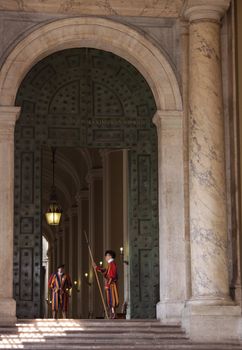The Swiss guard standing on guard outside of St. Peter's basilica in Vatican City.