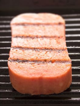 close up of spam on a grill