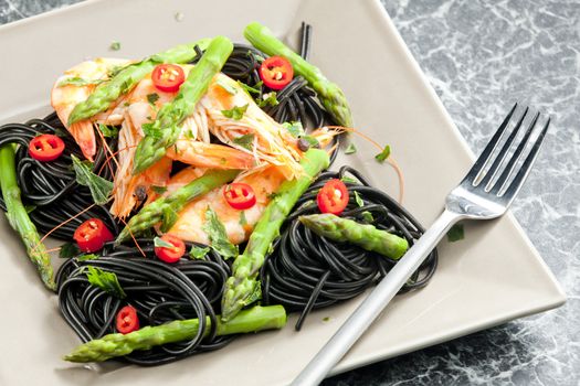 sepia spaghetti with prawns, asparagus and chilli