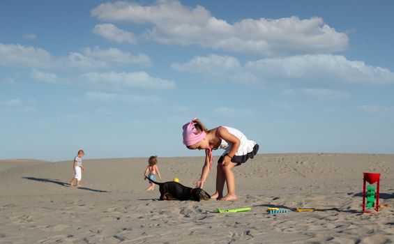 little girl play with puppy