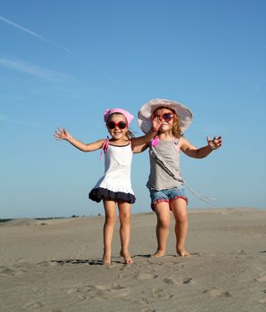 two little girl jumping