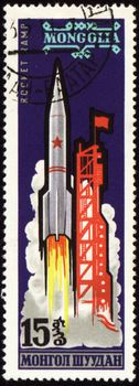 Postage stamp printed in Mongolia shows rocket start, circa 1963