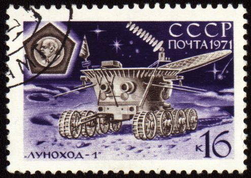 Postage stamp printed in USSR shows soviet moon machine Lunokhod-1 on Lunar surface