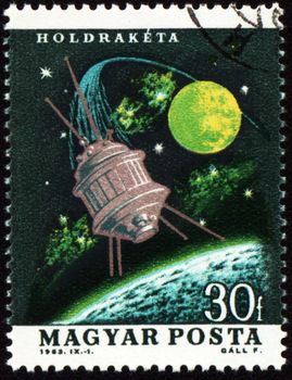 HUNGARY - CIRCA 1963: A stamp printed in Hungary shows flight of moon spaceship, circa 1963