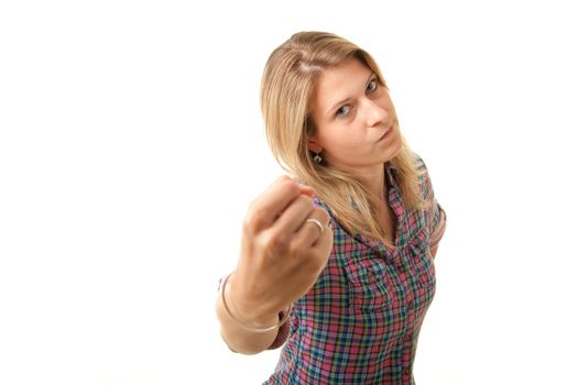 a angry young adult woman threatening with her fist