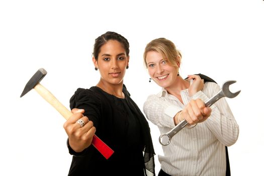 two young businesswoman showing hammer and wrench as tools