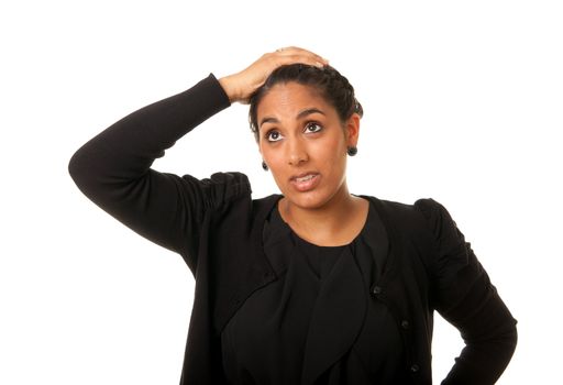 a young indian worried looking woman with her hand at her head